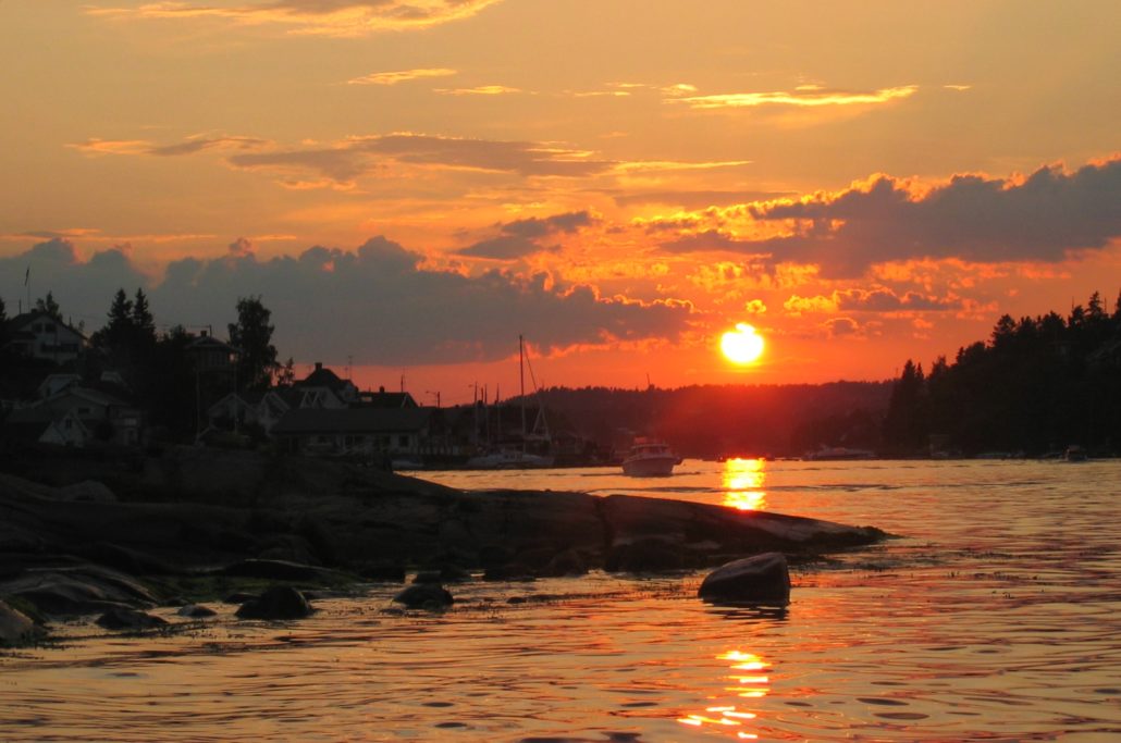 Beautiful sunset over the bay, reminding boaters to follow Dockshare's safety tips for nighttime navigation.