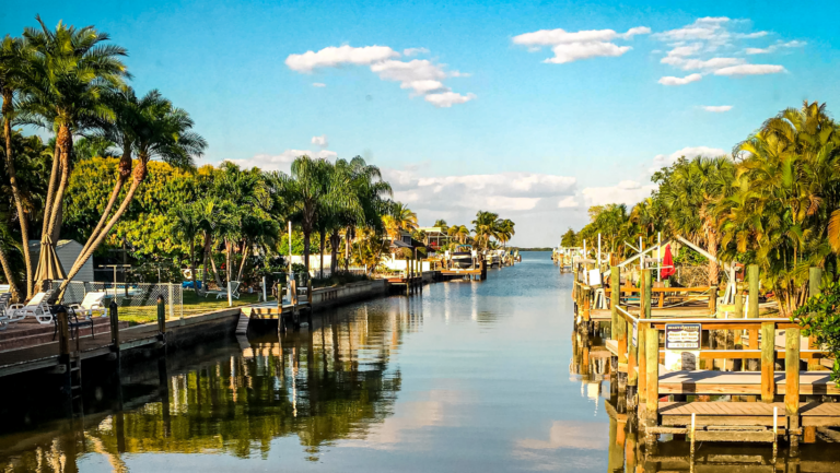 canal in Florida with calm waters and empty docks on each side