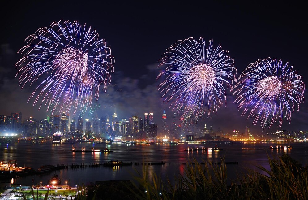 Fireworks over a vibrant city skyline and dock, celebrating Dockshare's vision to make 2025 the year you turn your dock into a money-maker.