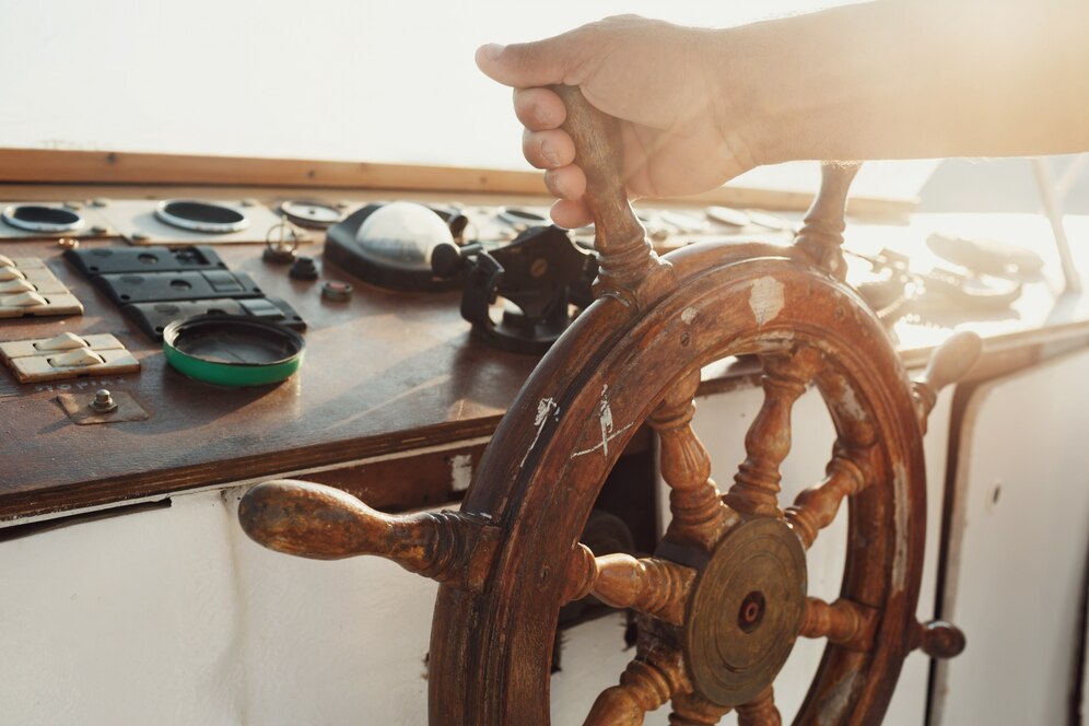 Dockshare vs. Traditional Marinas - sun shines wooden wheel held by man, Dockshare