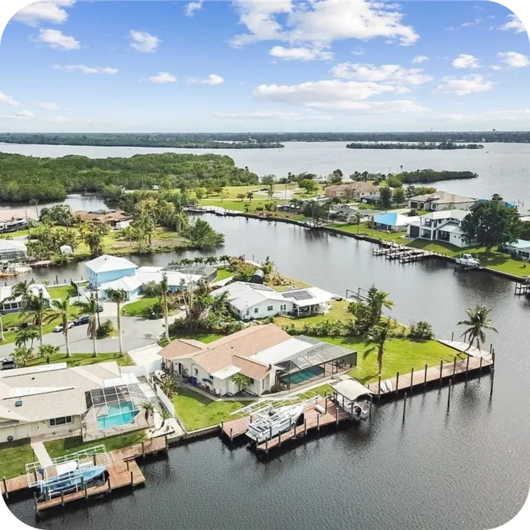 aerial shot of a house in florida at the intersection of two residential canals