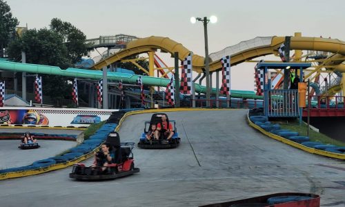 20230727_195203 go karts speeding along a raceway