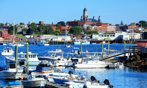 several boats docks and moored in a harbor of private dock rentals near gloucester ma