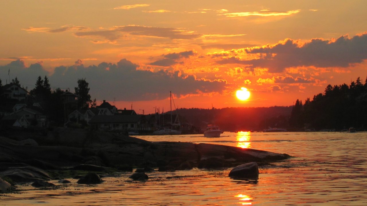 Beautiful sunset over the bay, reminding boaters to follow Dockshare's safety tips for nighttime navigation.